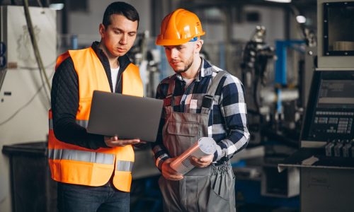 Two colleagues at a factory
